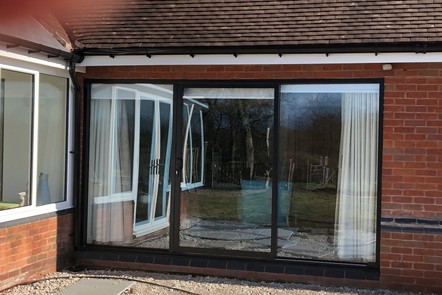Brown Aluminium Triple Track Patio Door Brown Aluminium Triple Track Patio Door,