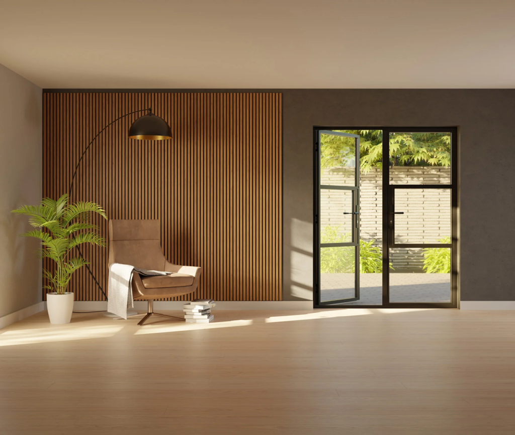 Modern interior with black-framed French doors opening onto a garden, with a warm wood slat feature wall.