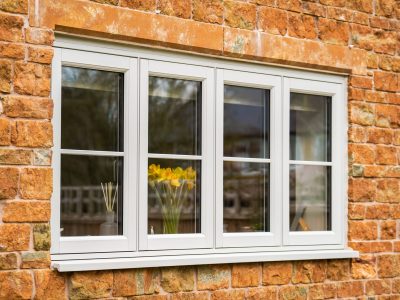 Agate grey flush fit PVCu casement windows installed on a traditional brick home in Derbyshire